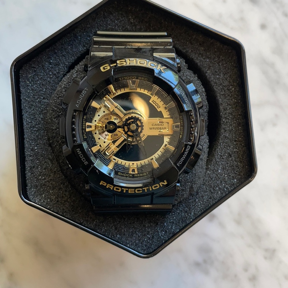 G-SHOCK GA110GB-1ACR Watch. Gold and Black.